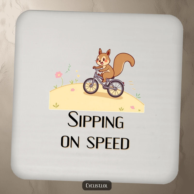 Funny squirrel bicycle coaster with a happy squirrel speeding down a hill on a tiny bike, designed to protect surfaces with a humorous touch.