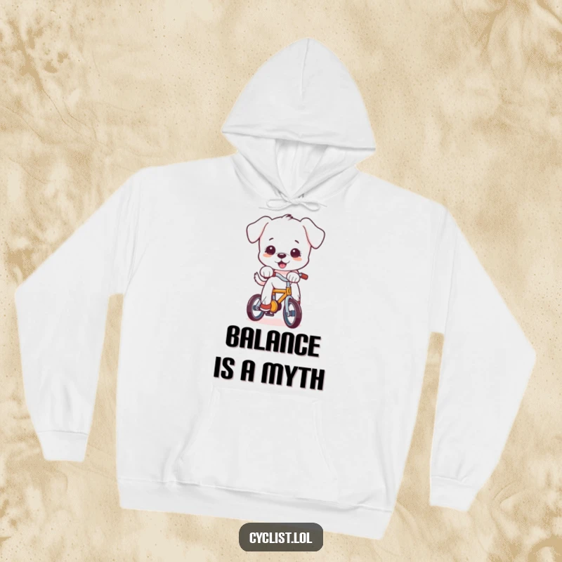 Funny puppy character struggling to stay upright on a tiny bike, detailed on a comfortable hoodie, perfect for a humorous and warm feel.