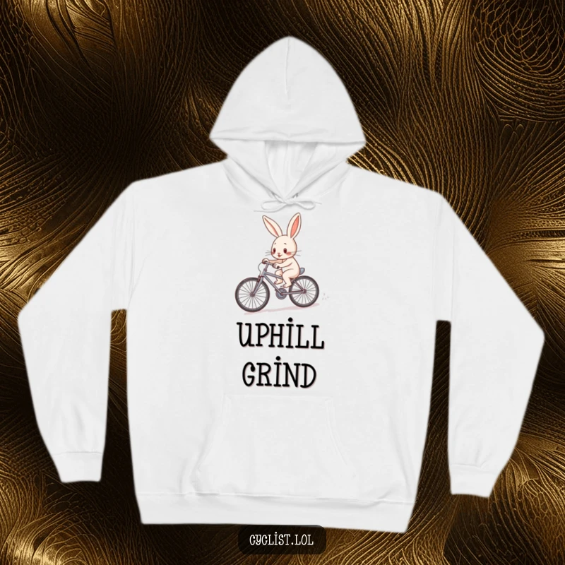 Funny determined rabbit character pedaling a tiny bicycle uphill on a cozy hoodie, symbolizing effort and perseverance.