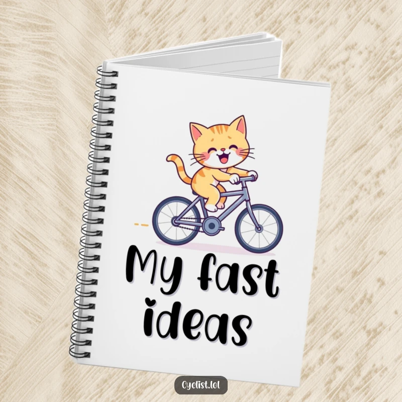 Funny cat bicycle notebook with a cheerful cat pedaling furiously on a tiny racing bicycle, ideal for jotting down notes with feline flair.