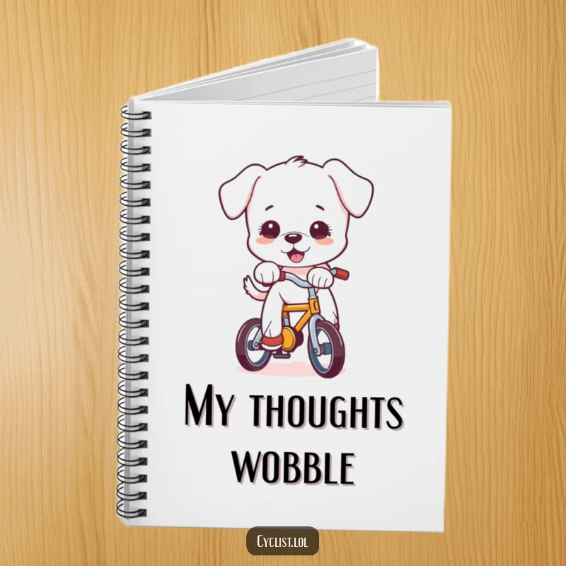 Funny puppy character balancing unsteadily on a small bicycle, depicted on the cover of a notebook, ideal for jotting down funny thoughts.